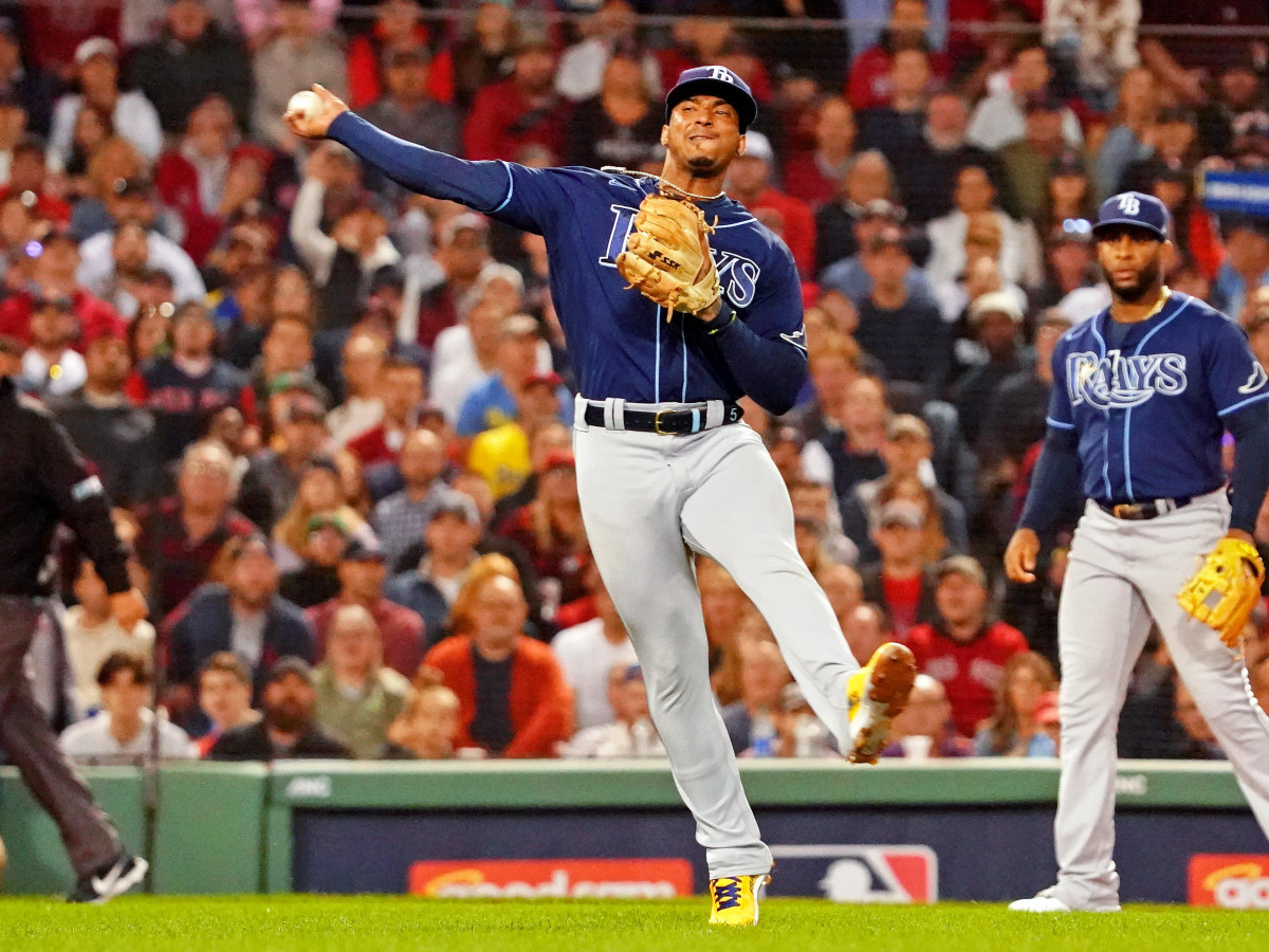 Oct 11, 2021; Boston, Massachusetts, USA; Tampa Bay Rays shortstop Wander Franco (5) throws to first base against the Boston Red Sox during the first inning during game four of the 2021 ALDS at Fenway Park.